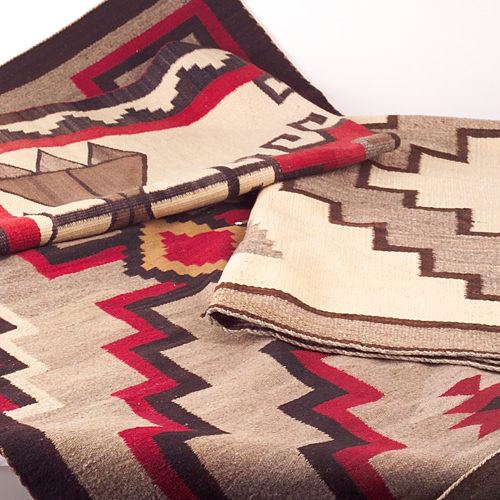 Appraisal: NAVAJO Three rugs with geometric patterns in ivory dark brown