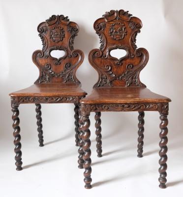 Appraisal: A pair of th Century oak hall chairs on barley