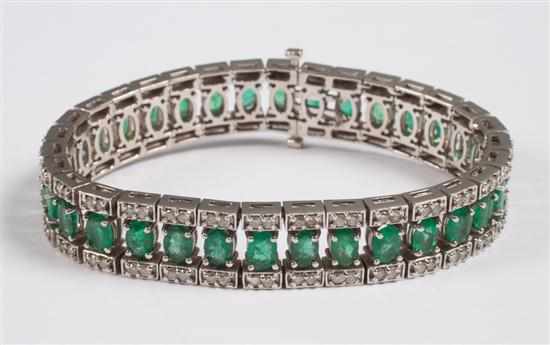 Appraisal: Diamond and emerald flexible link bracelet set into unmarked white