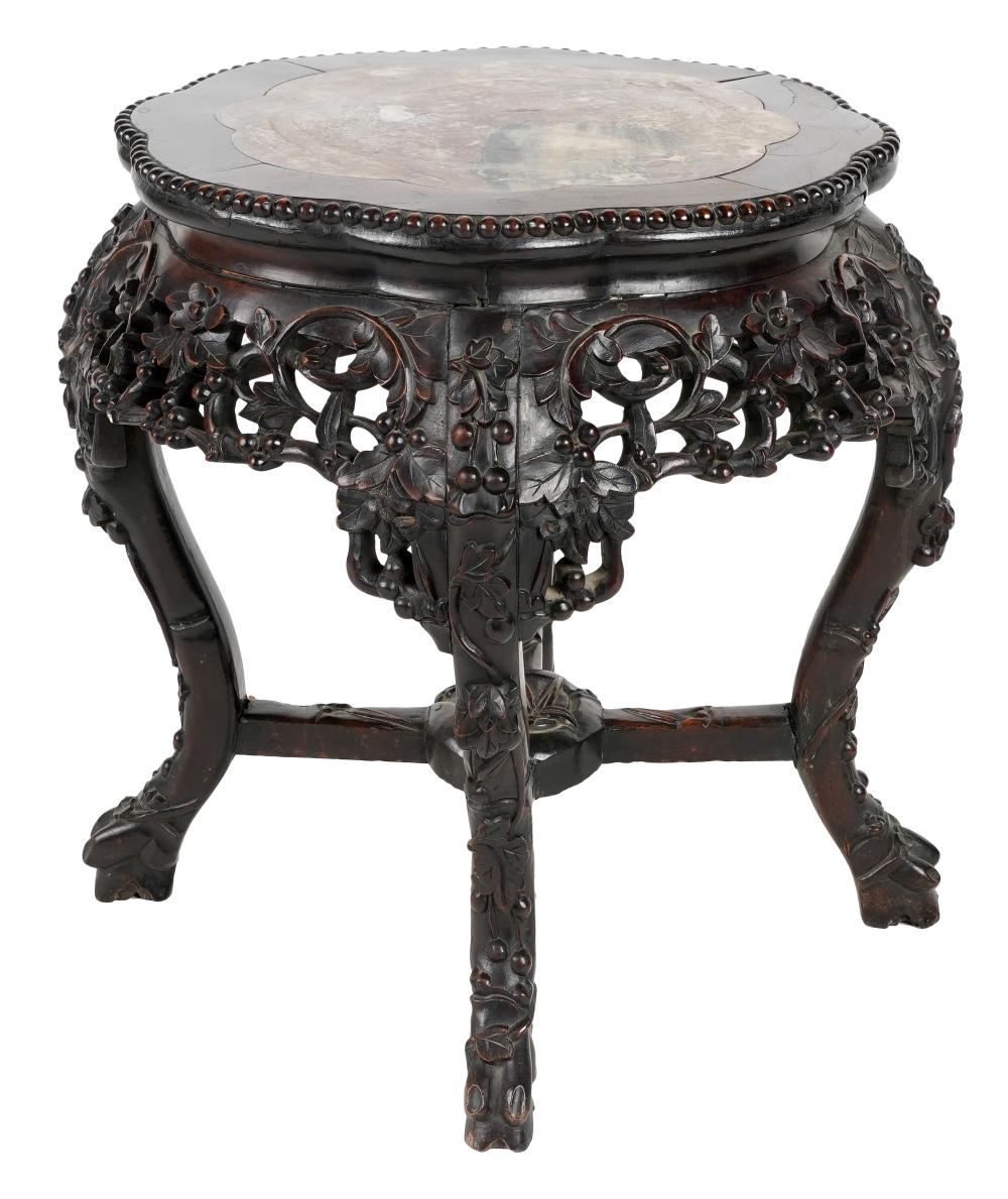 Appraisal: CHINESE CARVED WOOD TABORETwith inset marble top Provenance The Estate