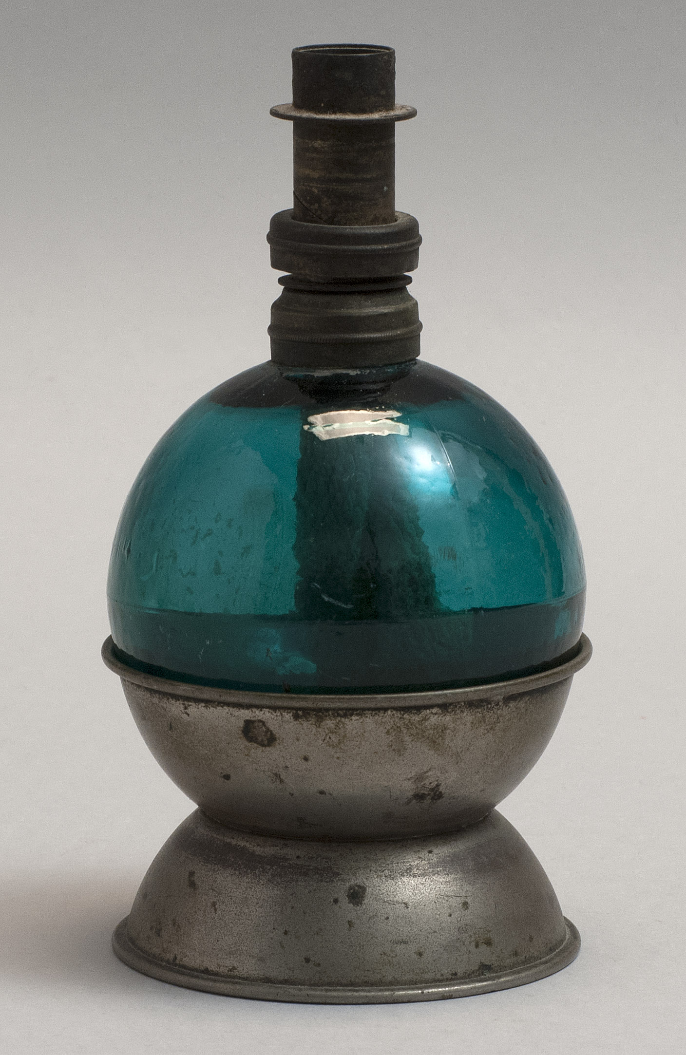 Appraisal: UNUSUAL JEWELER'S LAMP th CenturyEmerald green glass globular bottle supported