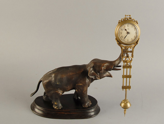 Appraisal: An Elephant Mystery Swinger Clock high long