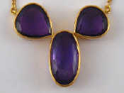 Appraisal: A yellow metal tests carat gold amethyst pendant necklace largest