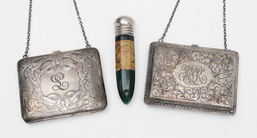 Appraisal: STERLING SILVER PURSES AND A SCENT BOTTLE pieces total to