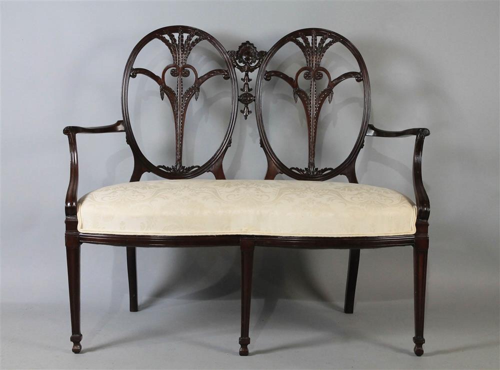 Appraisal: GEORGIAN NEOCLASSICAL CARVED MAHOGANY DOUBLE CHAIRBACK SETTEE ca having a