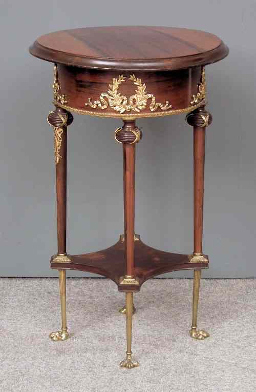 Appraisal: A French rosewood and gilt metal mounted circular occasional table