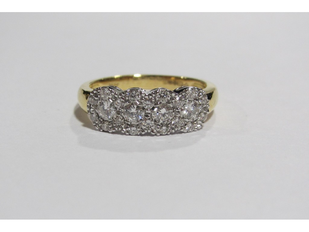 Appraisal: An eighteen carat bi colour gold diamond cluster ring with