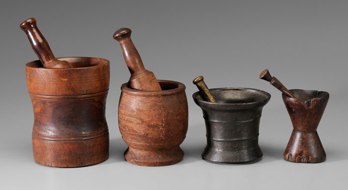 Appraisal: Four Wood Brass Mortars and Pestles th century or earlier