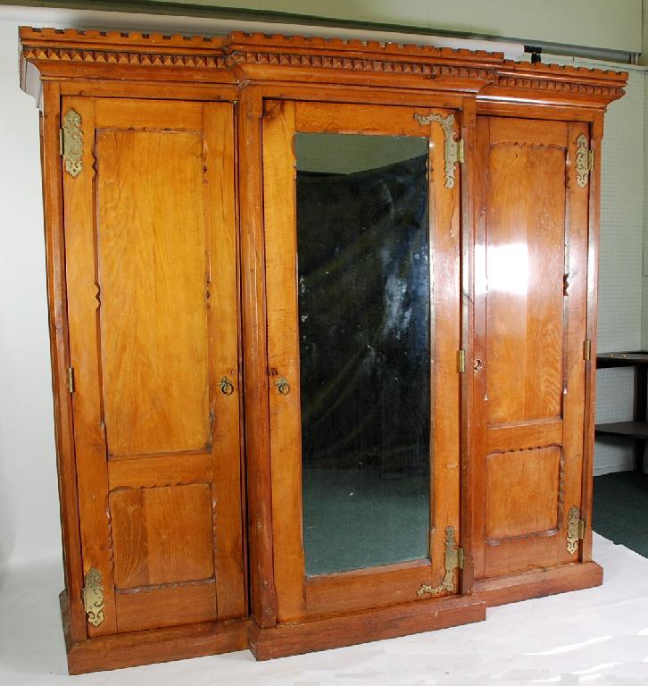 Appraisal: LATE NINETEENTH CENTURY OAK ARTS AND CRAFTS BREAKFRONT WARDROBE the