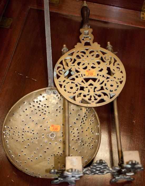 Appraisal: Wrought iron and brass strainer and a brass hanging fireplace