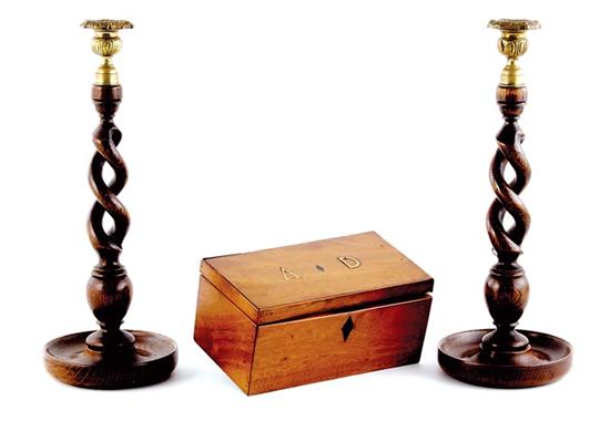 Appraisal: English barley-twist candlesticks and tea caddy brass sockets supported by