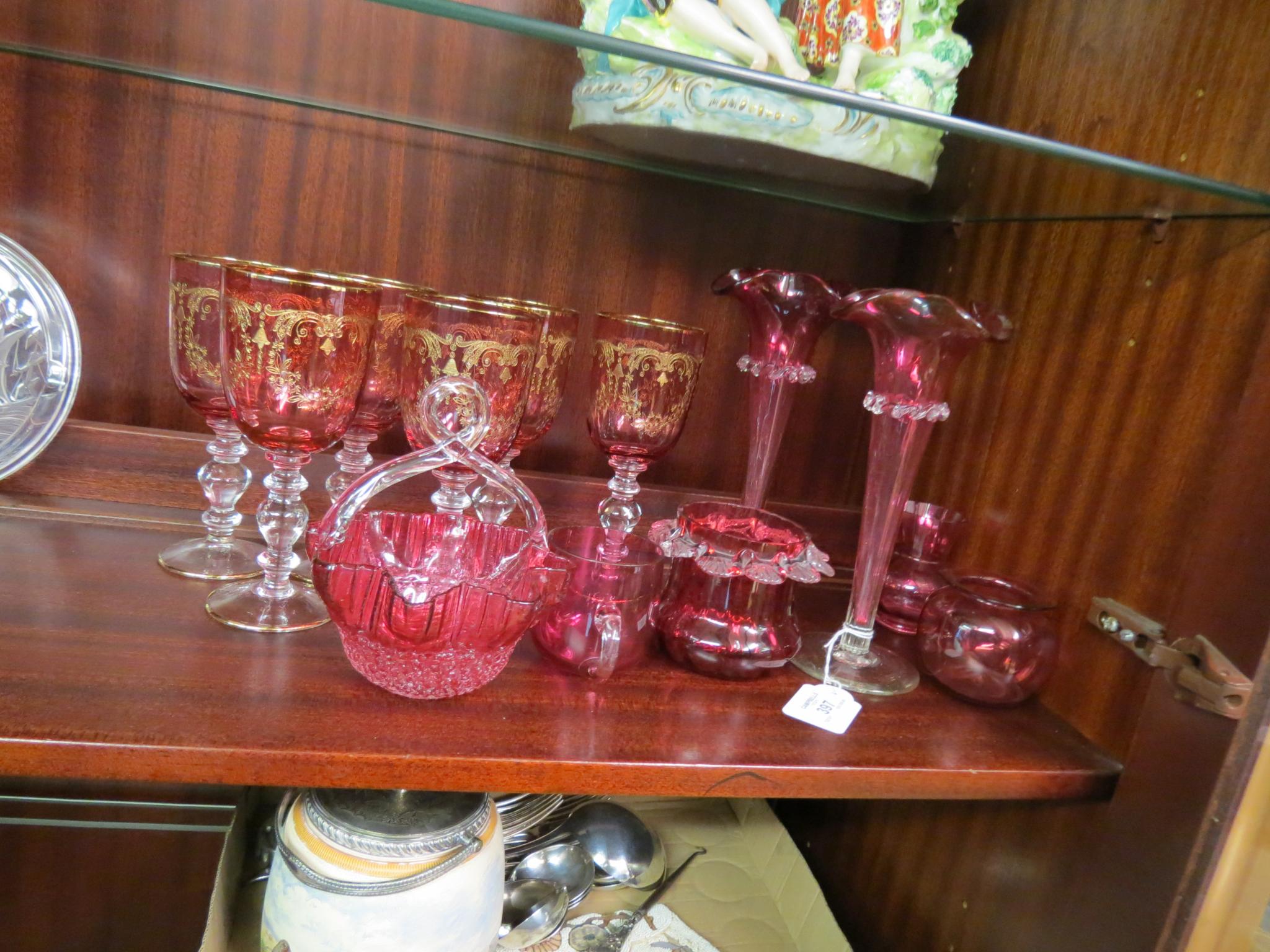 Appraisal: A pair of Victorian cranberry glass posy vases tapering-shape with