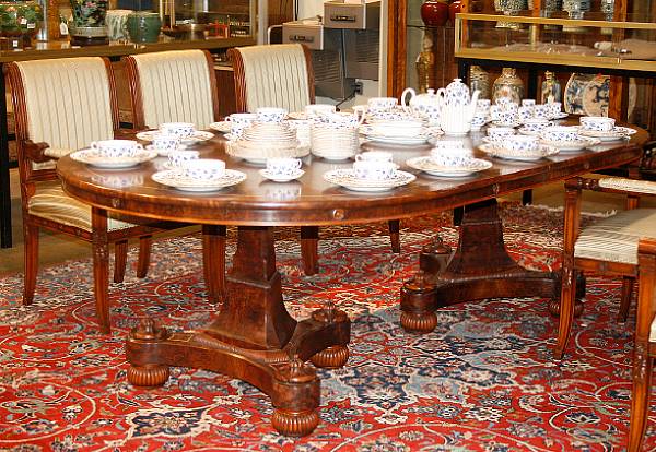 Appraisal: A Charles X style inlaid mahogany double pedestal dining table