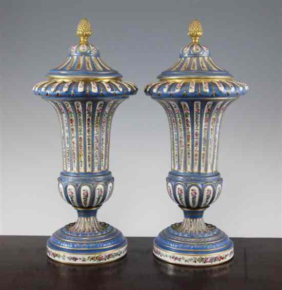 Appraisal: A pair of French Sevres style porcelain vases and covers