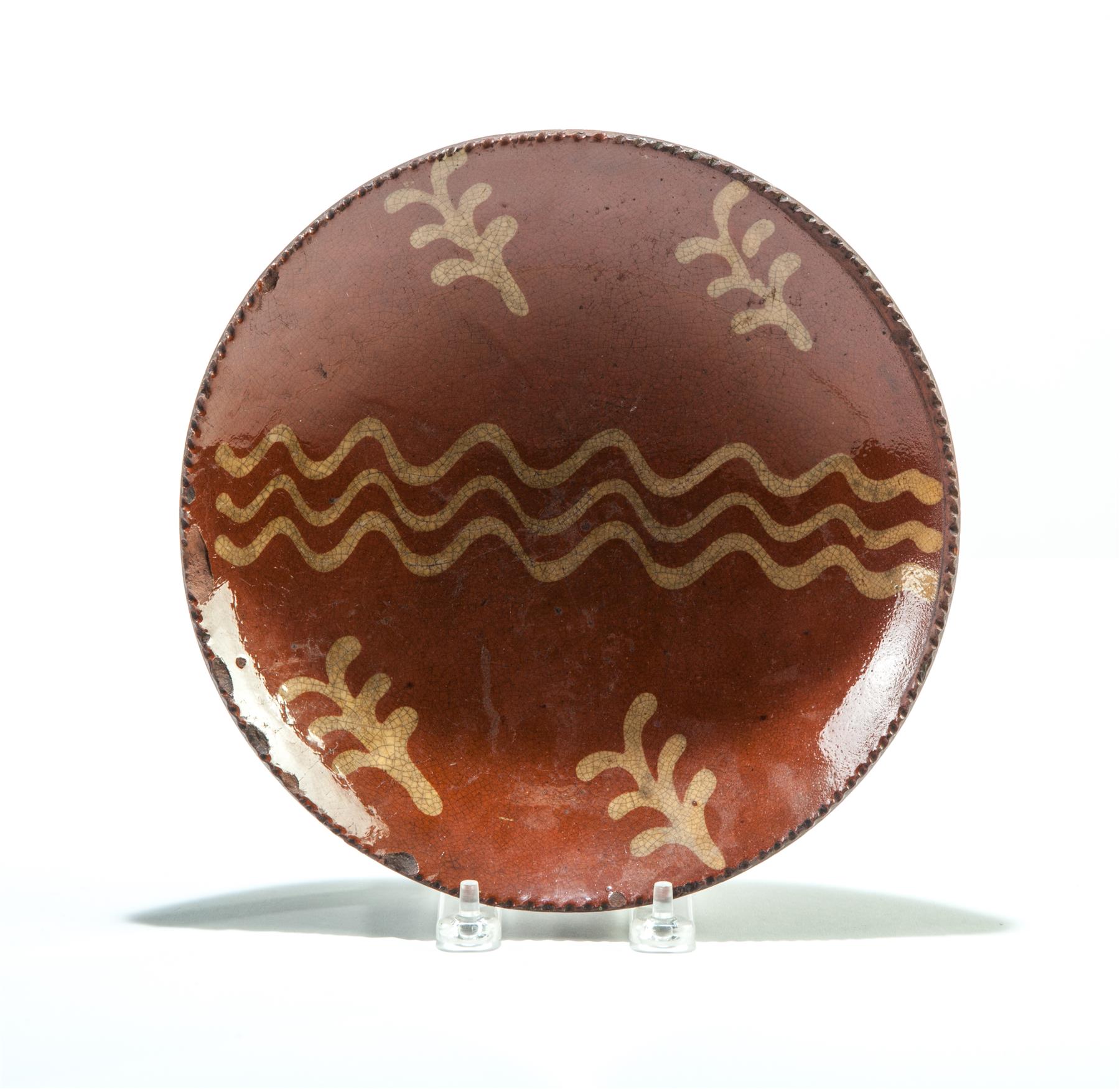 Appraisal: AMERICAN REDWARE PIE PLATE Mid th century Coggled rim and