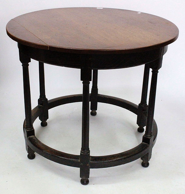 Appraisal: AN ANTIQUE CIRCULAR OAK CENTRE TABLE with six turned legs