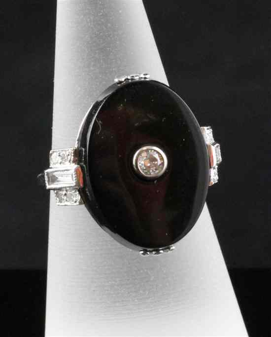 Appraisal: An ct white gold diamond and black onyx dress ring