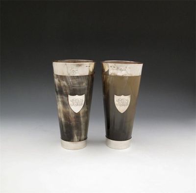 Appraisal: A pair of Victorian Scottish provincial silver mounted horn beakers