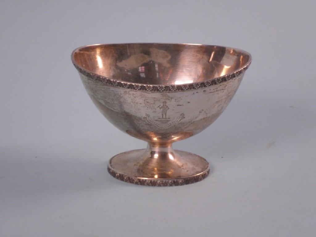 Appraisal: An oval silver sugar bowl with foliate border engraved with