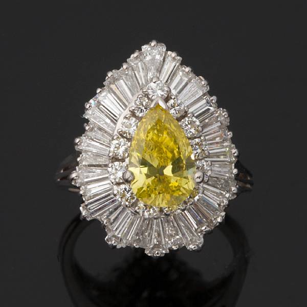 Appraisal: A colored diamond and diamond ring centering a yellow pear-shaped