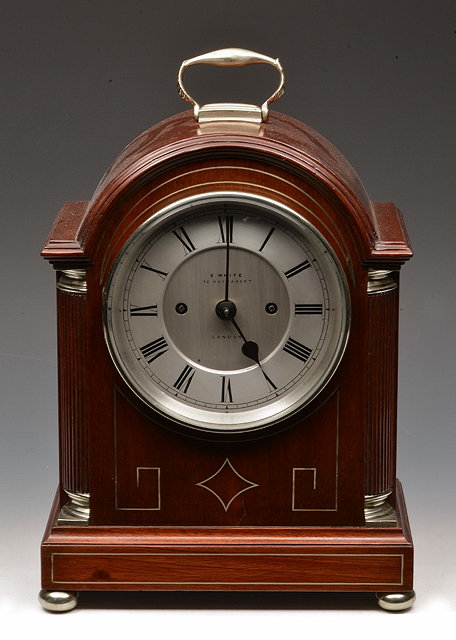 Appraisal: A REGENCY STYLE MAHOGANY SMALL SIZE BRACKET CLOCK the silvered