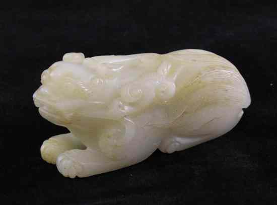 Appraisal: A Chinese white jade figure of a lion-dog in recumbent