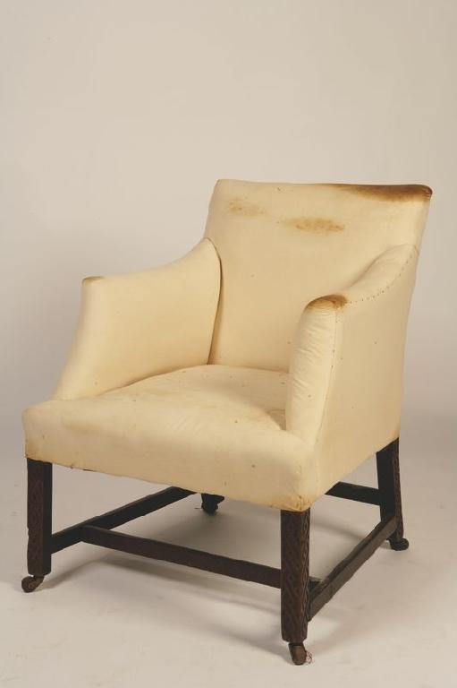 Appraisal: A GEORGE III MAHOGANY LOW BACK ARMCHAIR the upholstered back