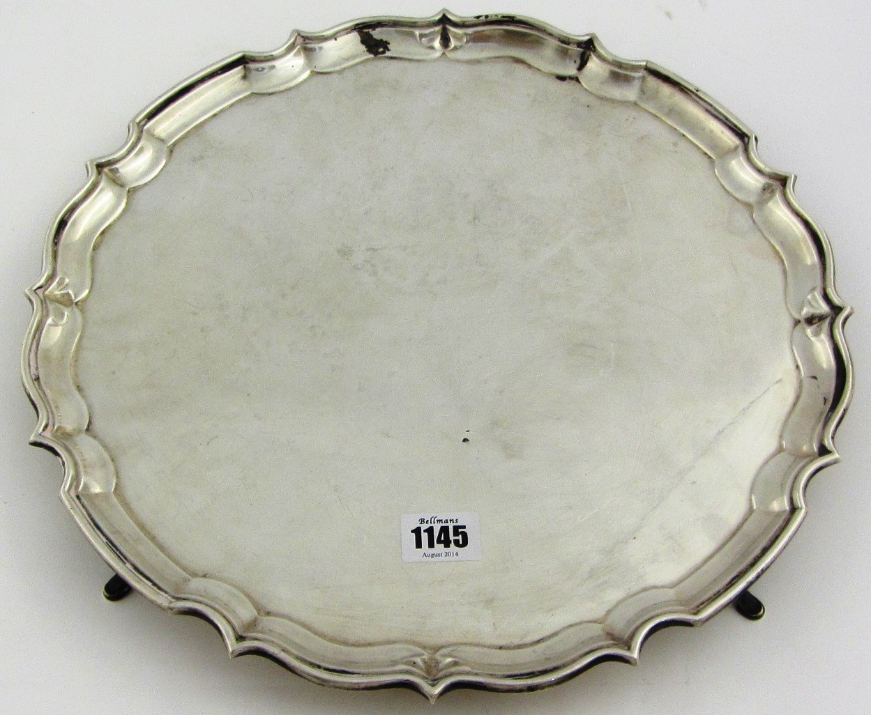 Appraisal: A silver shaped circular Chippendale style salver with a piecrust