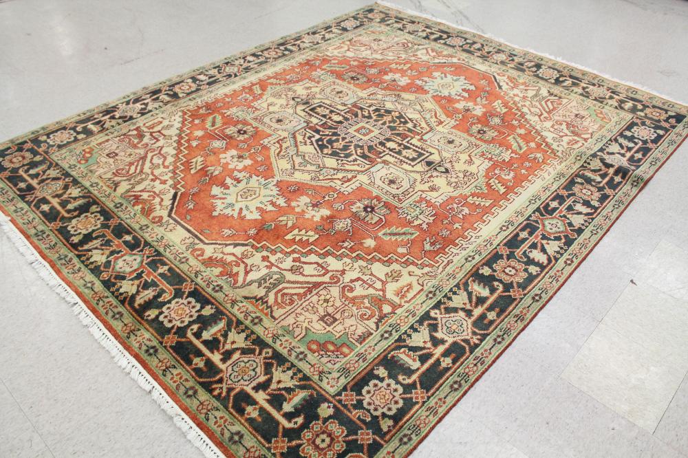 Appraisal: HAND KNOTTED ORIENTAL CARPET Persian Serapi design central geometric medallion