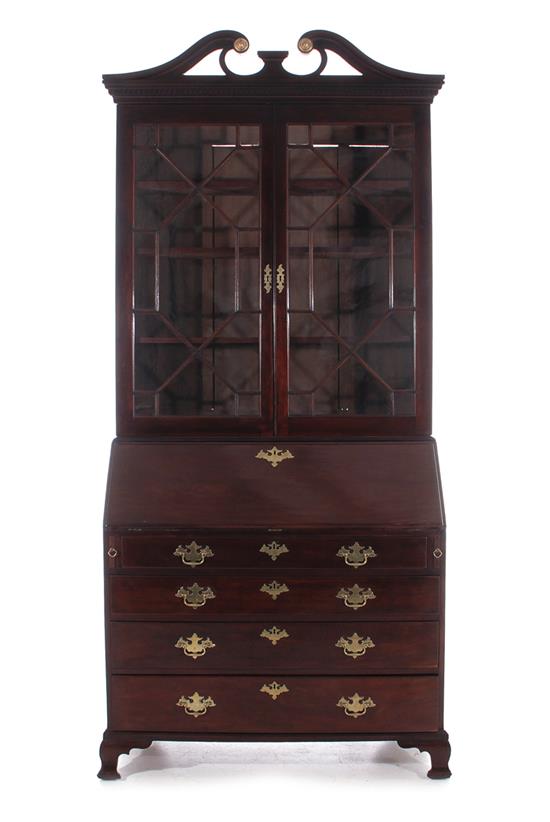 Appraisal: Georgian mahogany secretary bookcase early th century broken-arch crown divided