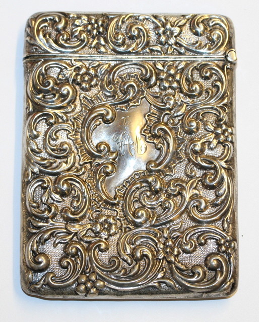 Appraisal: AN EDWARDIAN SILVER CARD CASE with pressed scroll decoration Birmingham