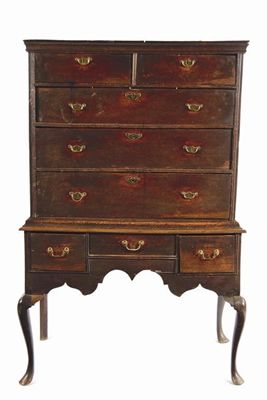 Appraisal: An oak chest on stand with two short and three