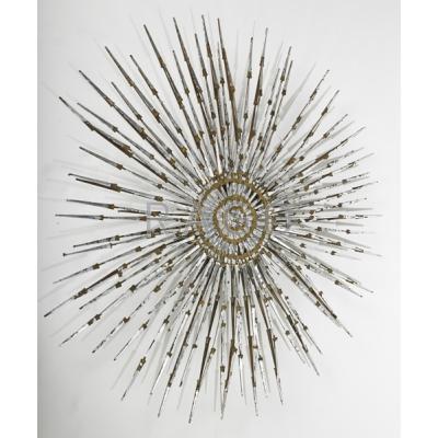 Appraisal: STYLE OF WILLIAM BOWIE Nail sunburst wall sculpture Silver and