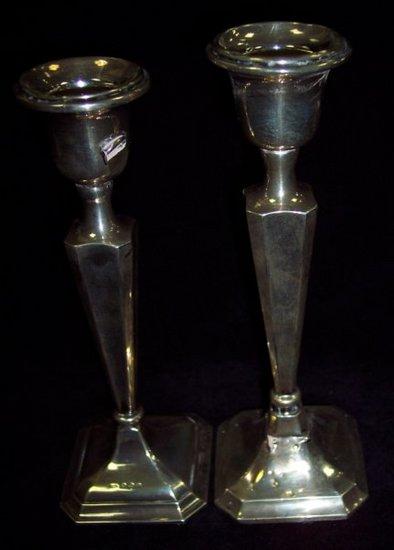 Appraisal: A candlestick with tapered column and square base cm high