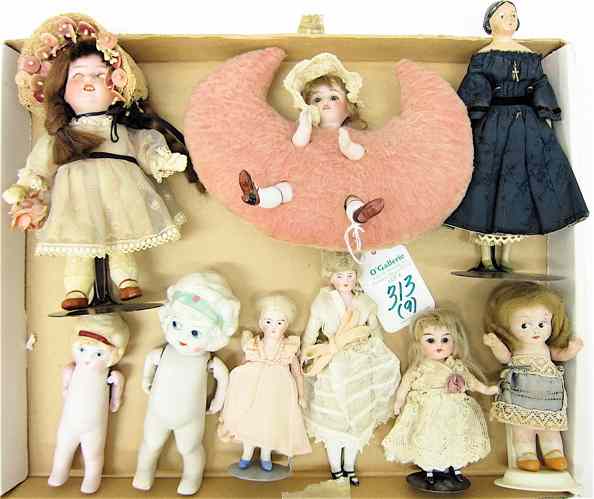 Appraisal: COLLECTION OF NINE MINIATURE SMALL DOLLS German shoulder head one