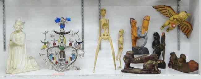 Appraisal: Misc lot including erotic carvings South American pottery group skeleton