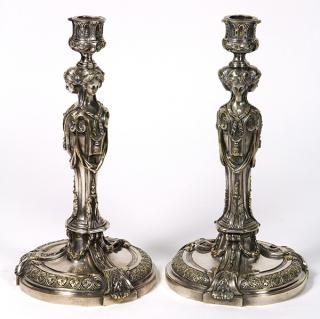 Appraisal: Pair of Continental silvered bronze candlesticks Pair of Continental silvered