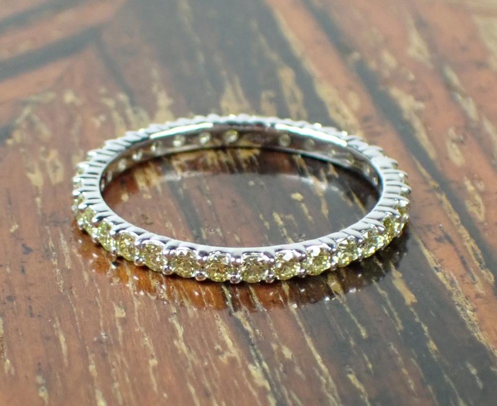 Appraisal: YELLOW DIAMOND AND FOURTEEN KARAT GOLD BAND The k white