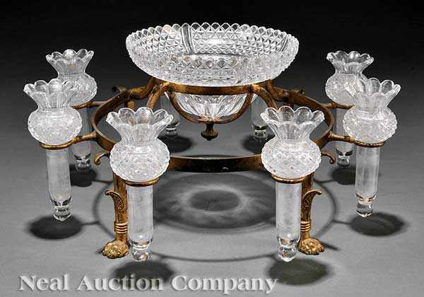 Appraisal: A Continental Gilt and Cut Glass Epergne central bowl amid