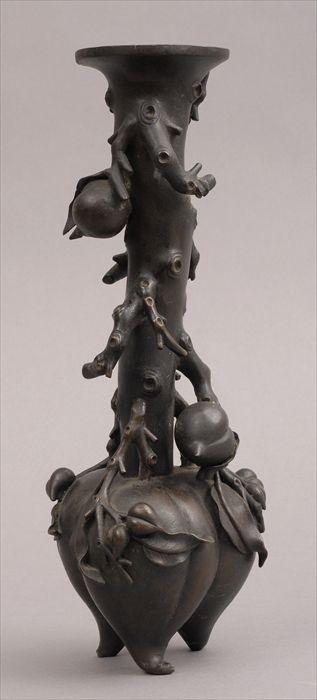 Appraisal: JAPANESE BRONZE VASE The tripod gourd-form base centering a fruiting