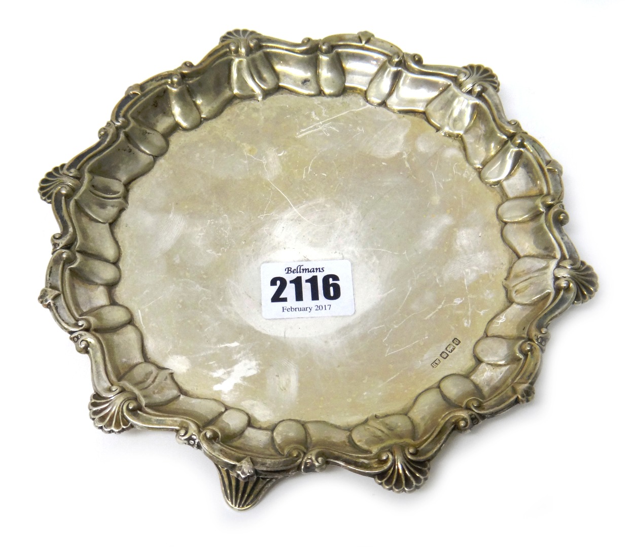 Appraisal: A silver shaped circular waiter having a shell and pie-crust