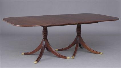 Appraisal: REGENCY-STYLE CARVED MAHOGANY TWO-PEDESTAL DINING TABLE The divided top with