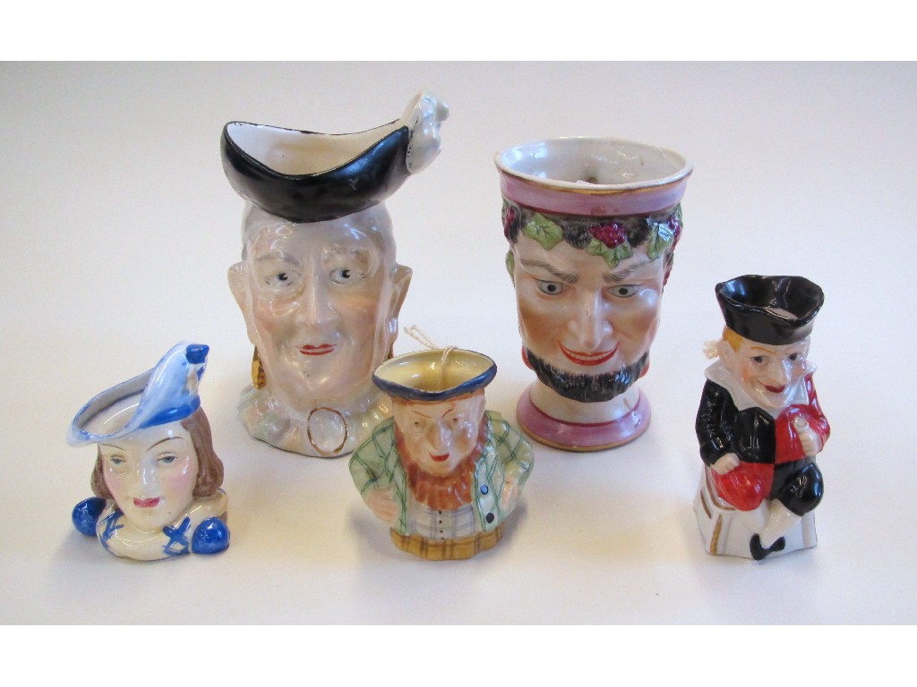 Appraisal: Four character jugs including Bacchus Arthur Bowker head of a