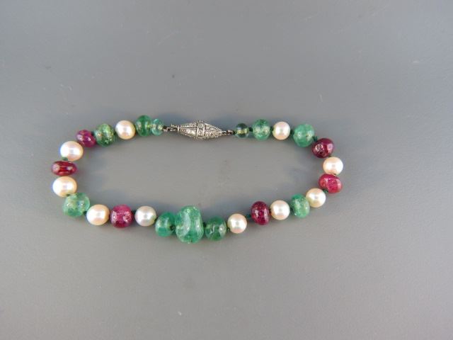 Appraisal: Diamond Emerald Ruby and Pearl Bracelet platinum clasp has diamonds