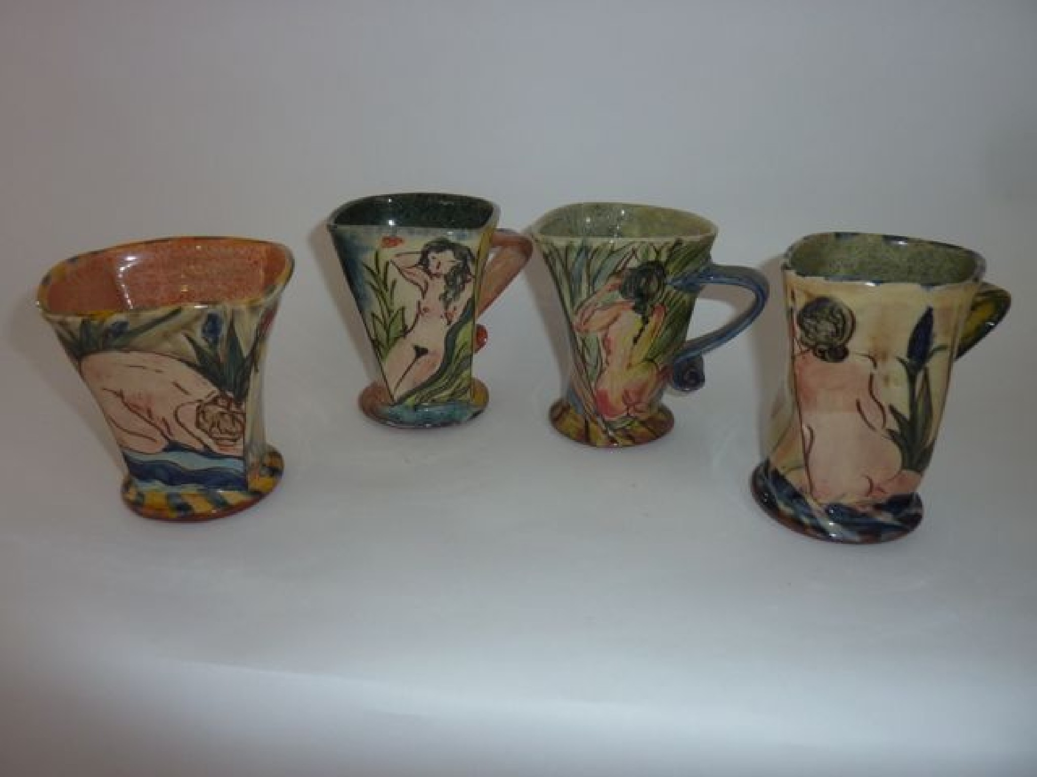 Appraisal: A set of four studio pottery mugs by Paul Jackson