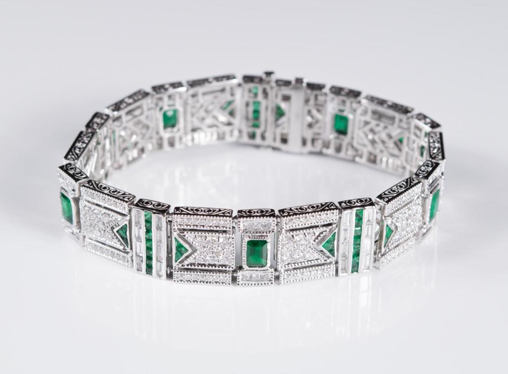 Appraisal: DIAMOND EMERALD AND FOURTEEN KARAT GOLD BRACELET The Art Deco