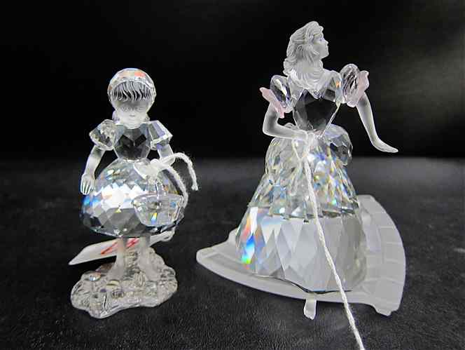 Appraisal: TWO SWAROVSKI CRYSTAL FIGURINES ''Cinderella '' introduced in designed by