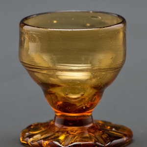 Appraisal: A Blown-Glass Saltcellar in Amber American Circa - Height inches