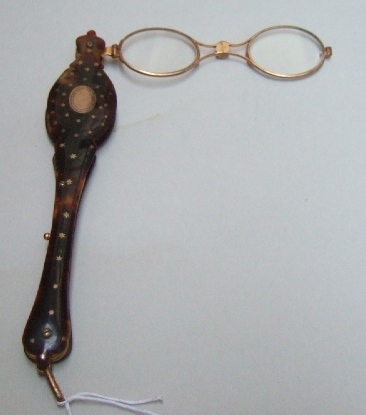 Appraisal: A ladies pair of gilt metal mounted sprung action tortoiseshell