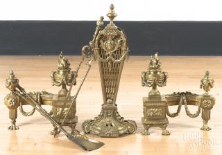 Appraisal: French brass fireplace set to include a pair of chenets